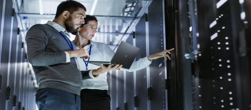 Picture-of-two-employees-working-in-server-room